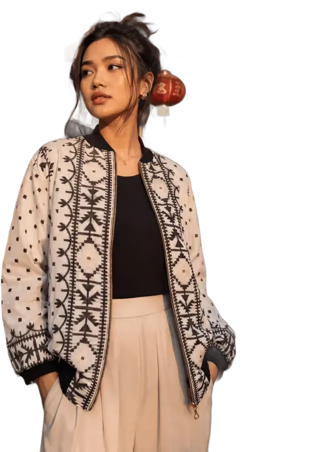Look 01: patterned jacket, black top, pale trousers
